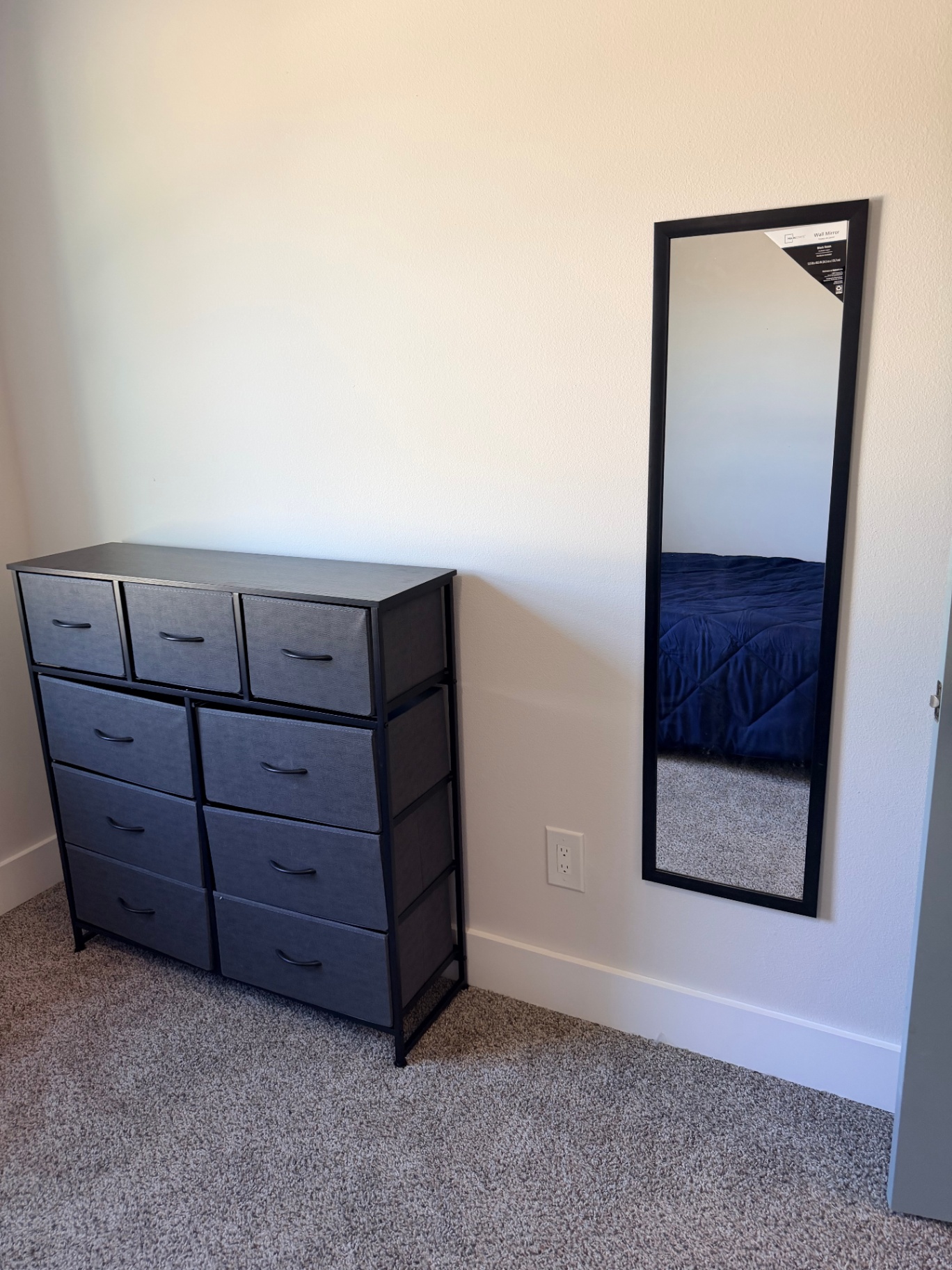 Tilgham House — bedroom dresser with wall-mounted mirror