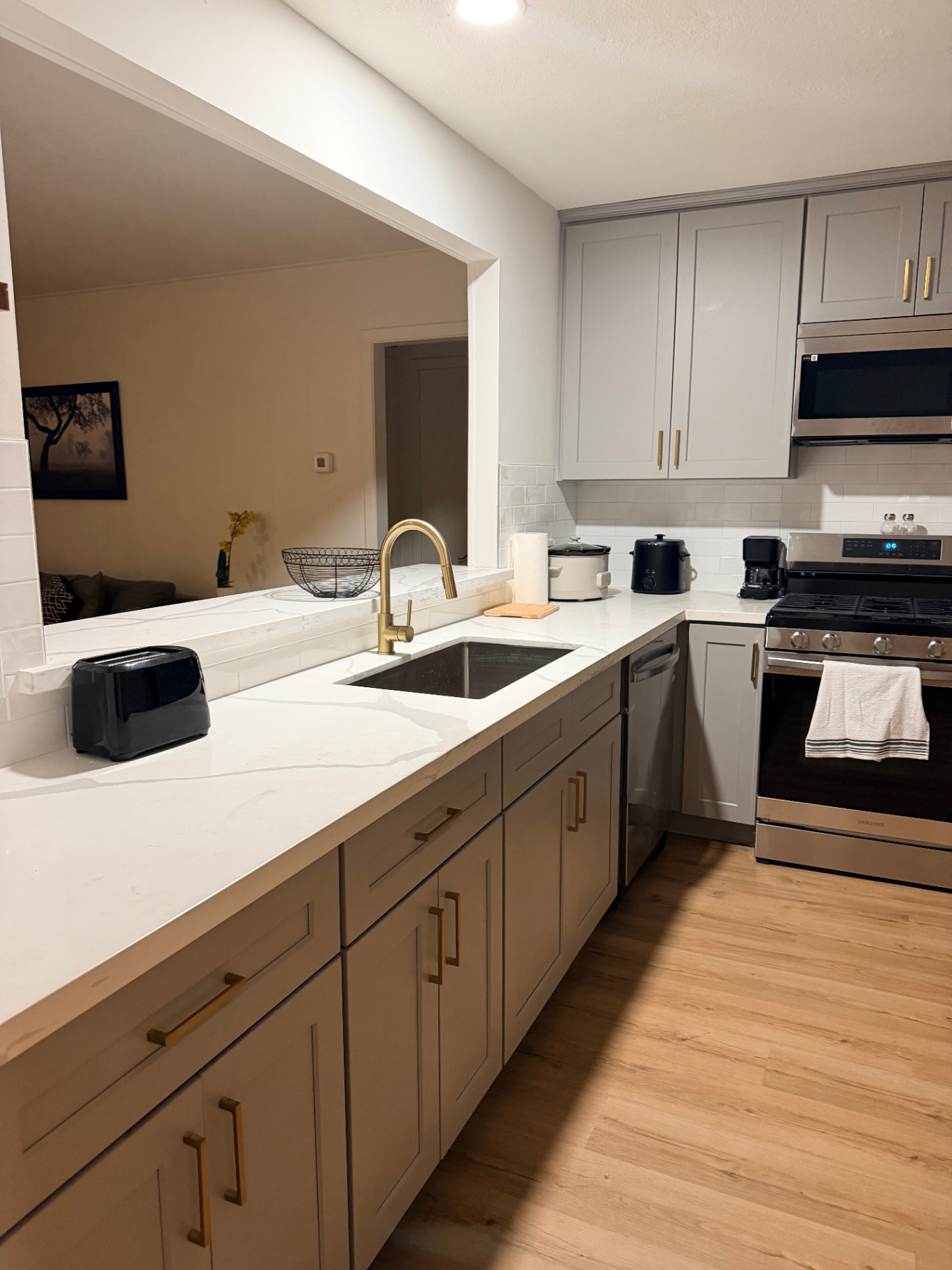 Fairgreen House — kitchen with quartz counters and gold fixtures