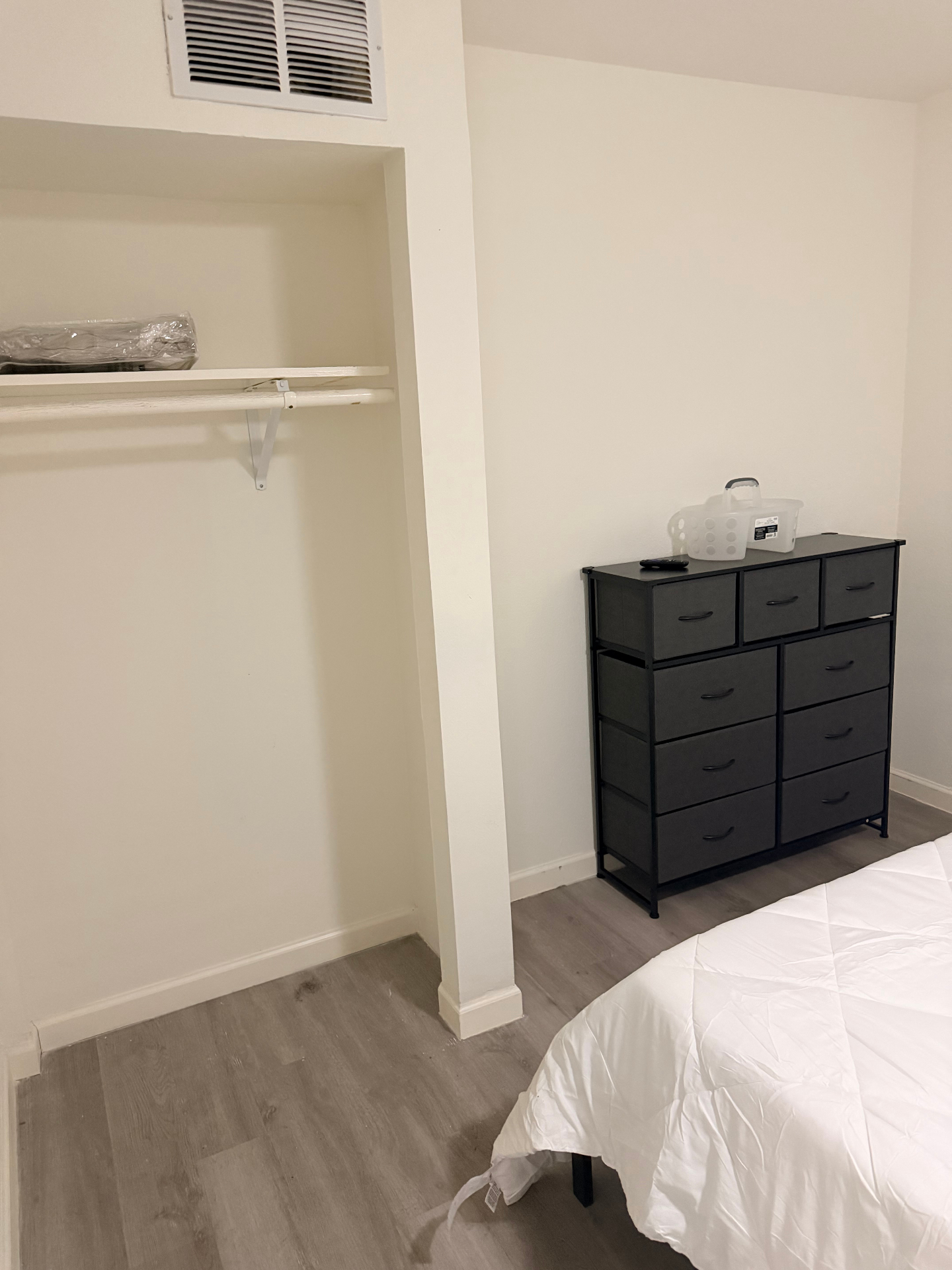 Cosby House — bedroom closet and multi-drawer black dresser