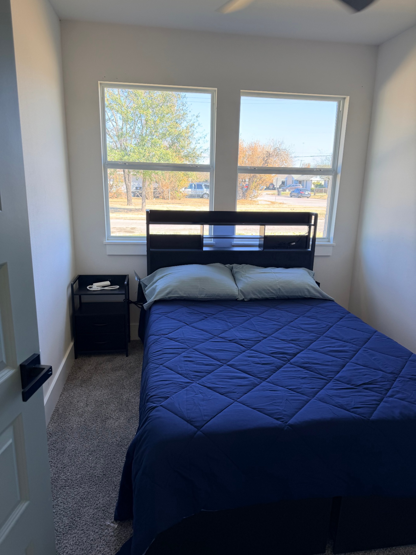 Tilgham House — furnished private bedroom with queen bed and bright window