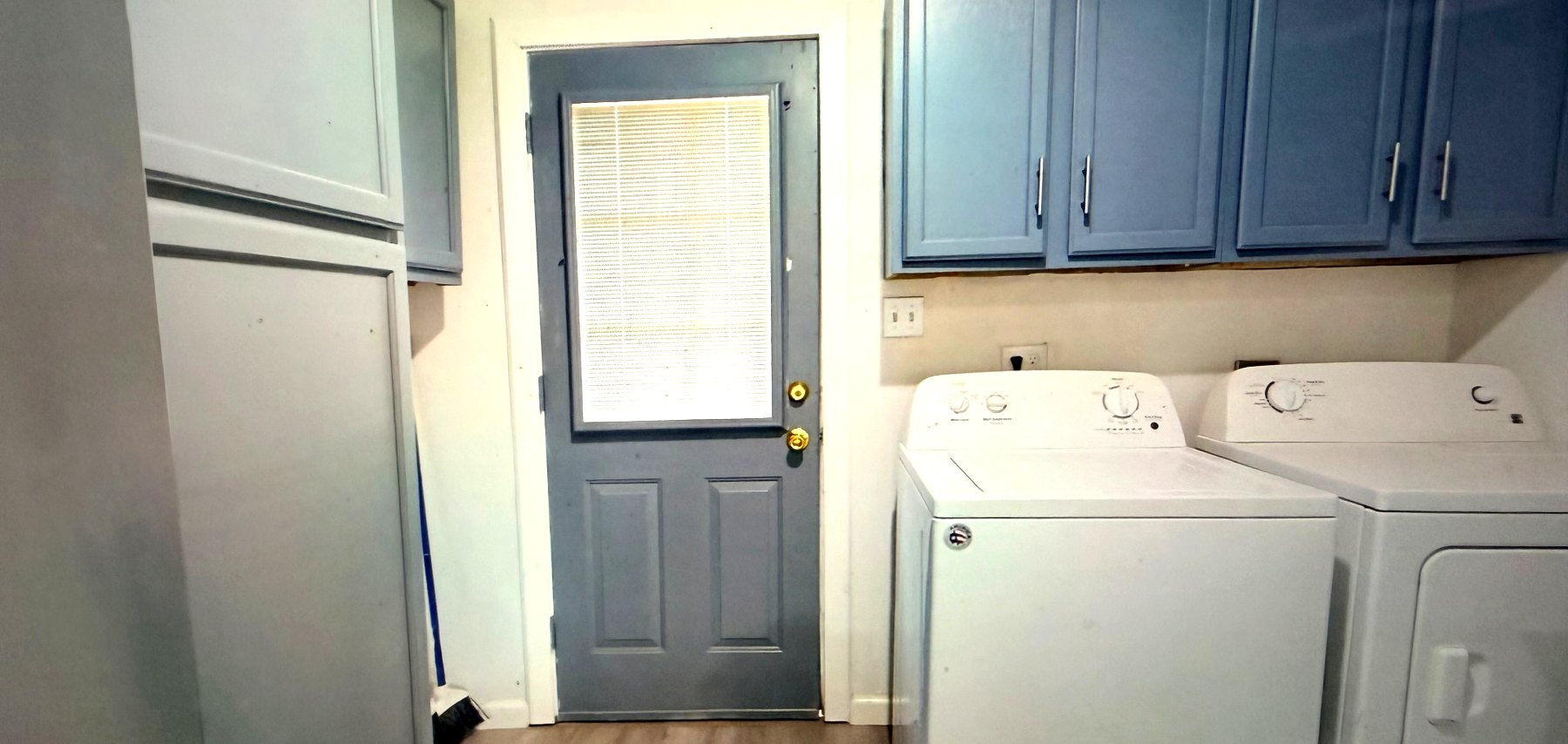 Cosby House — laundry area with washer, dryer and back door