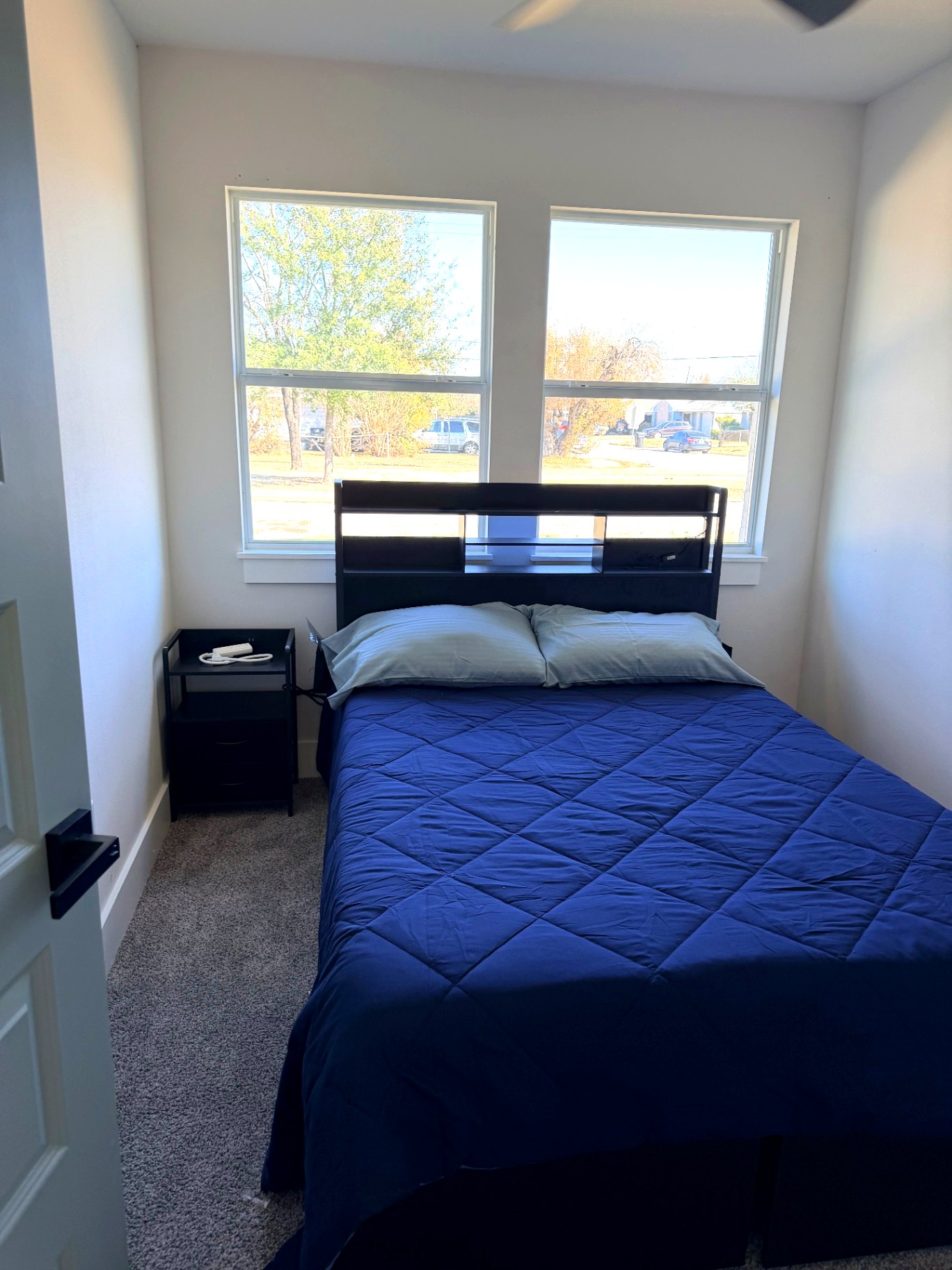 Tilgham House — sunny private bedroom with queen bed