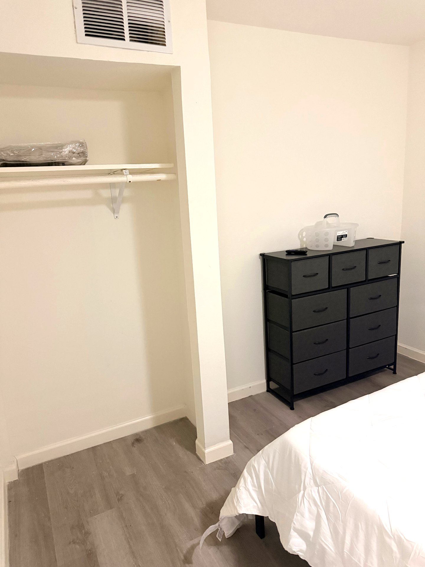 Cosby House — bedroom closet and multi-drawer black dresser