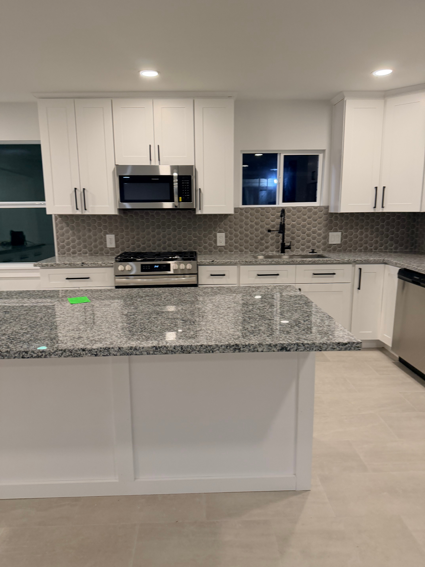 Tilgham House — kitchen with stainless appliances and gas range